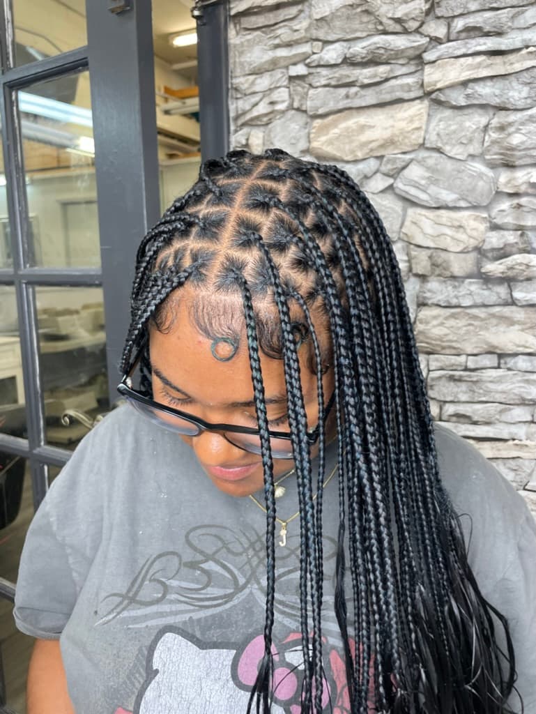 Small knotless braids styled by Akeelia Rose in Broward County